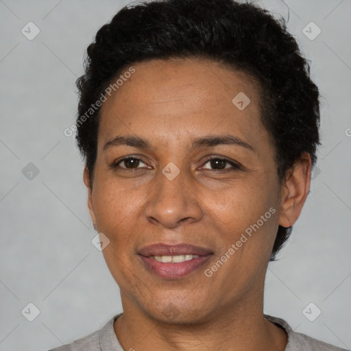 Joyful latino adult female with short  brown hair and brown eyes