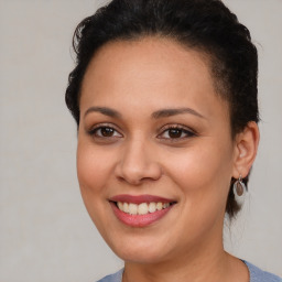 Joyful latino young-adult female with short  brown hair and brown eyes