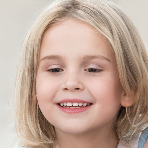 Joyful white child female with long  brown hair and blue eyes