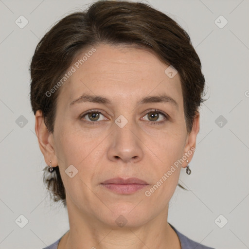 Joyful white adult female with short  brown hair and grey eyes