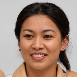 Joyful asian young-adult female with medium  brown hair and brown eyes