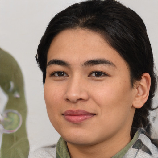 Joyful asian young-adult female with medium  brown hair and brown eyes