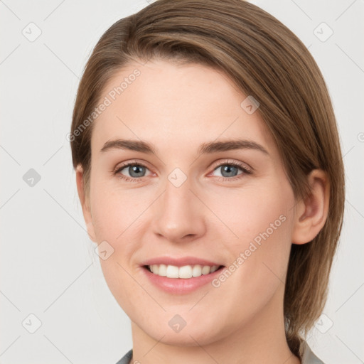 Joyful white young-adult female with medium  brown hair and grey eyes