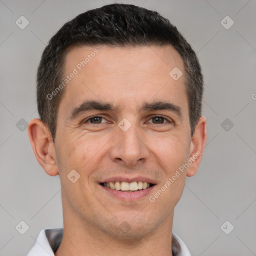 Joyful white adult male with short  brown hair and brown eyes