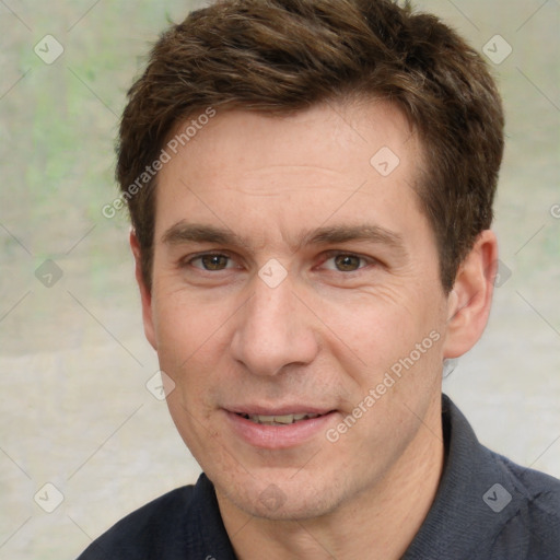 Joyful white adult male with short  brown hair and grey eyes