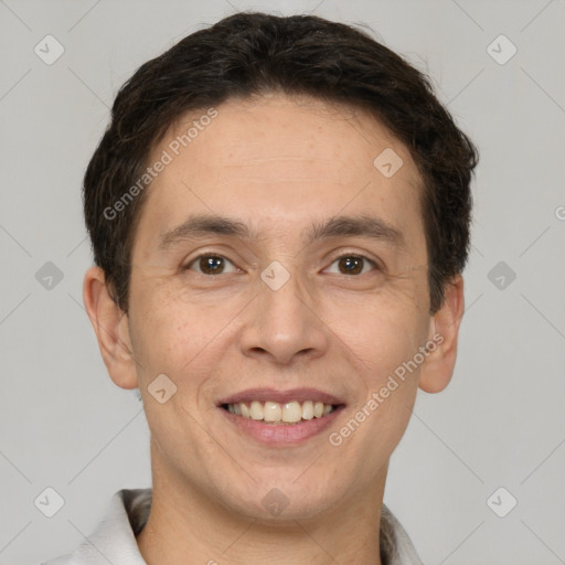 Joyful white adult male with short  brown hair and brown eyes