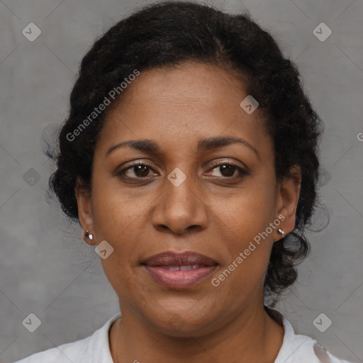 Joyful black adult female with short  brown hair and brown eyes