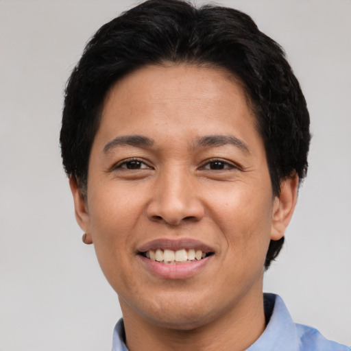Joyful asian adult female with short  black hair and brown eyes