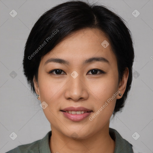 Joyful asian young-adult female with medium  black hair and brown eyes