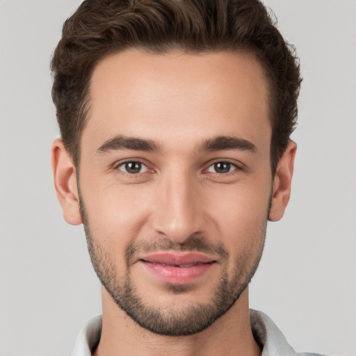 Joyful white young-adult male with short  brown hair and brown eyes