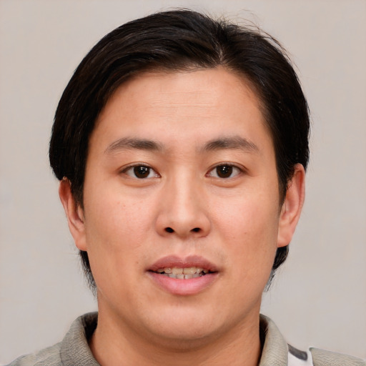 Neutral asian young-adult male with short  brown hair and brown eyes