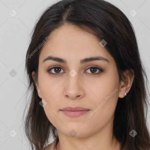 Joyful latino young-adult female with long  brown hair and brown eyes