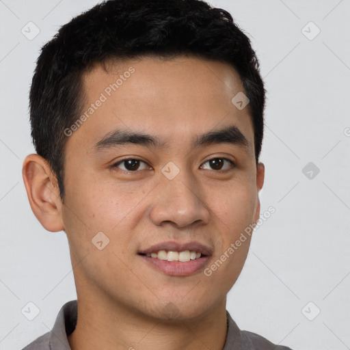 Joyful latino young-adult male with short  brown hair and brown eyes