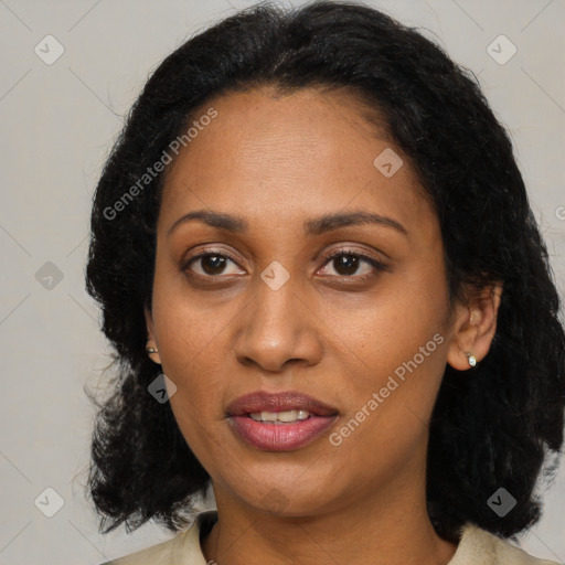 Joyful black adult female with medium  black hair and brown eyes