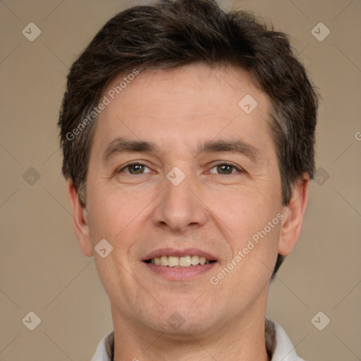 Joyful white adult male with short  brown hair and brown eyes