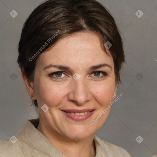 Joyful white adult female with medium  brown hair and grey eyes