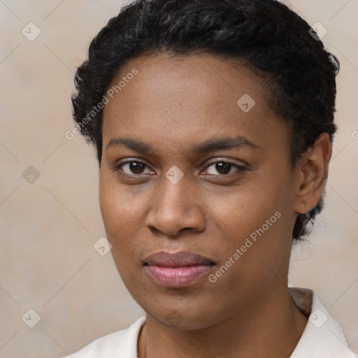 Joyful black young-adult female with short  black hair and brown eyes