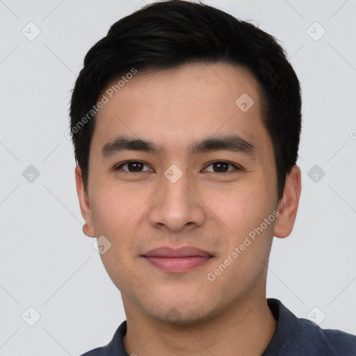 Joyful asian young-adult male with short  black hair and brown eyes