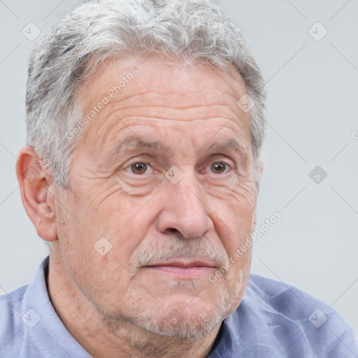 Neutral white middle-aged male with short  gray hair and brown eyes