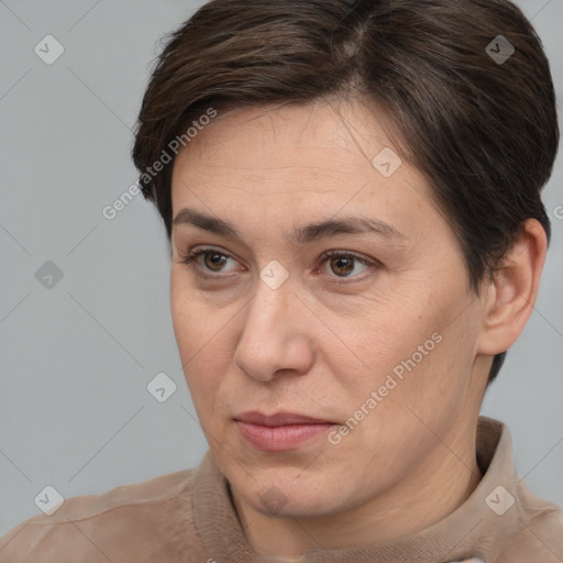 Joyful white adult female with short  brown hair and brown eyes