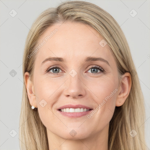 Joyful white adult female with long  brown hair and grey eyes