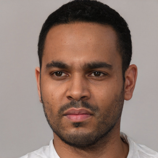 Neutral black young-adult male with short  black hair and brown eyes
