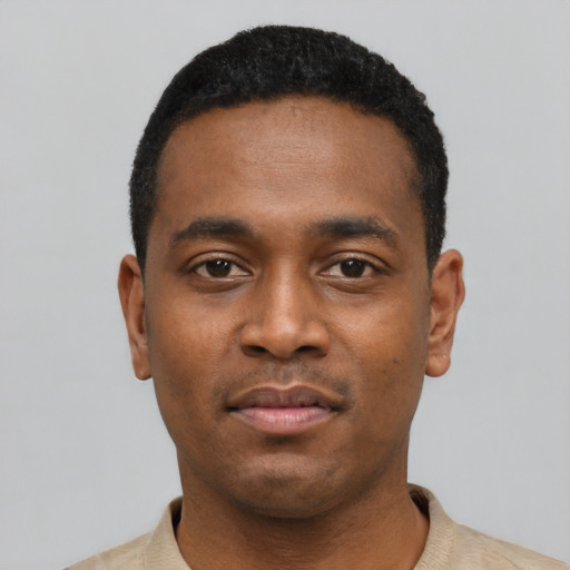 Neutral black young-adult male with short  black hair and brown eyes