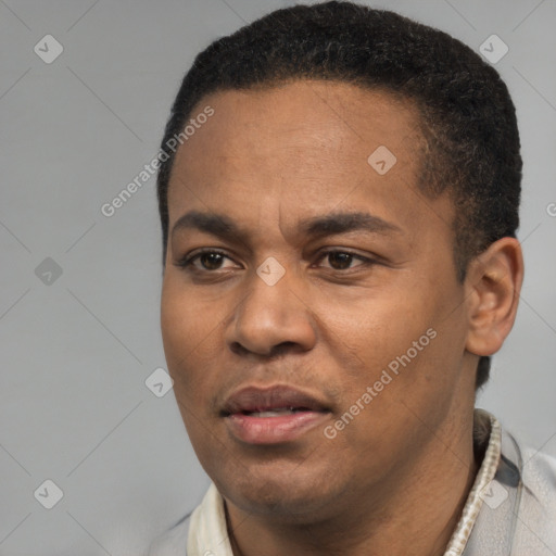 Joyful latino adult male with short  black hair and brown eyes