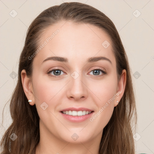 Joyful white young-adult female with long  brown hair and blue eyes