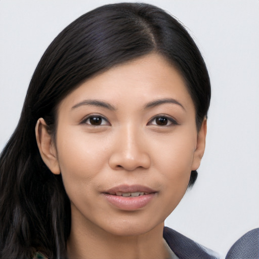 Joyful asian young-adult female with long  black hair and brown eyes