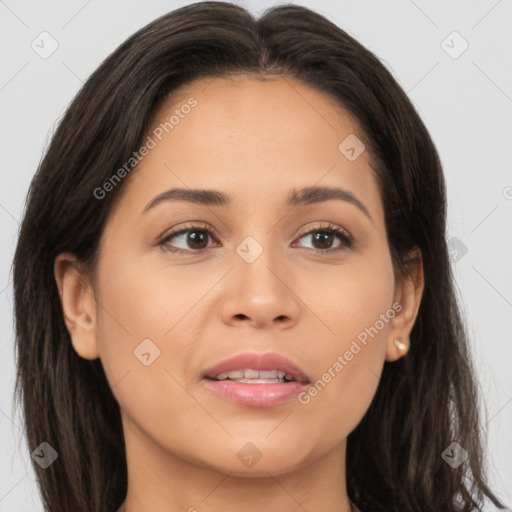 Joyful latino young-adult female with long  brown hair and brown eyes