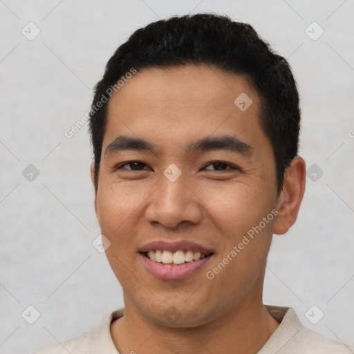 Joyful latino young-adult male with short  black hair and brown eyes