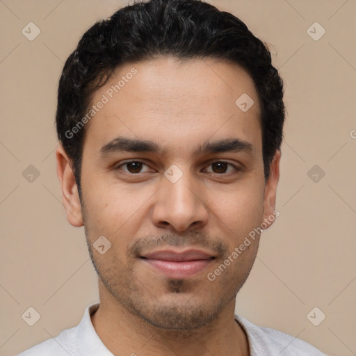 Joyful white young-adult male with short  black hair and brown eyes