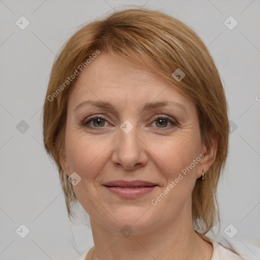 Joyful white adult female with medium  brown hair and brown eyes