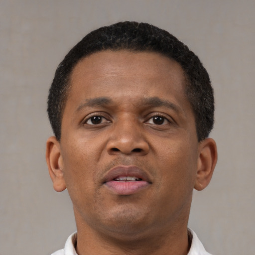 Neutral black young-adult male with short  brown hair and brown eyes