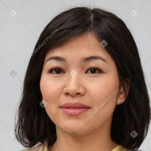 Joyful asian young-adult female with medium  brown hair and brown eyes