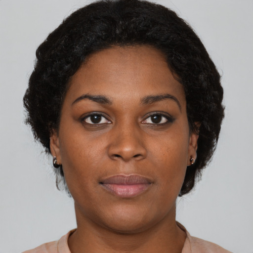 Neutral black young-adult female with short  brown hair and brown eyes