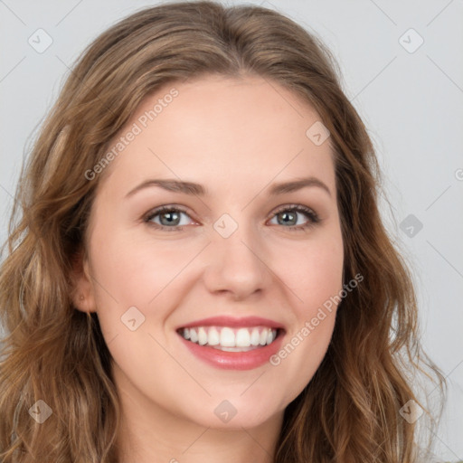 Joyful white young-adult female with long  brown hair and green eyes