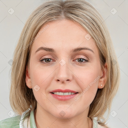 Joyful white young-adult female with medium  brown hair and blue eyes