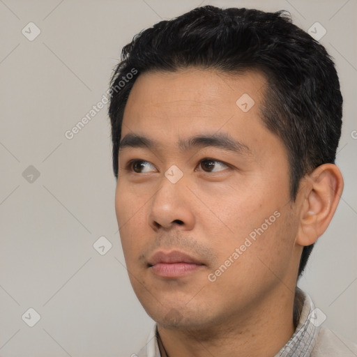 Neutral asian young-adult male with short  black hair and brown eyes