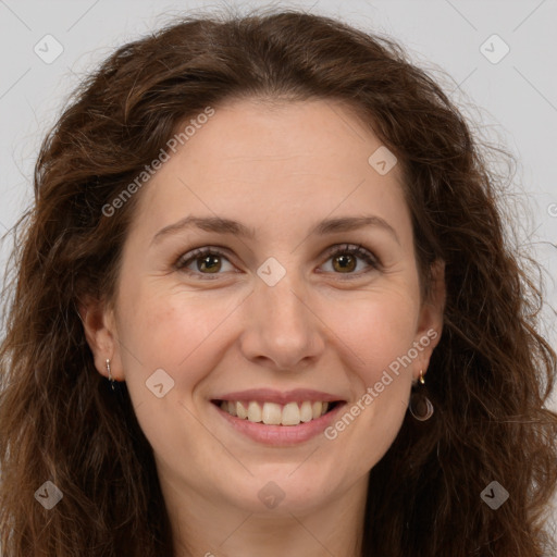 Joyful white adult female with long  brown hair and brown eyes