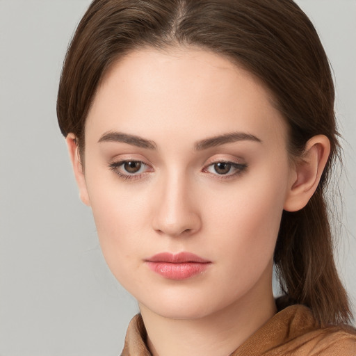 Neutral white young-adult female with long  brown hair and brown eyes