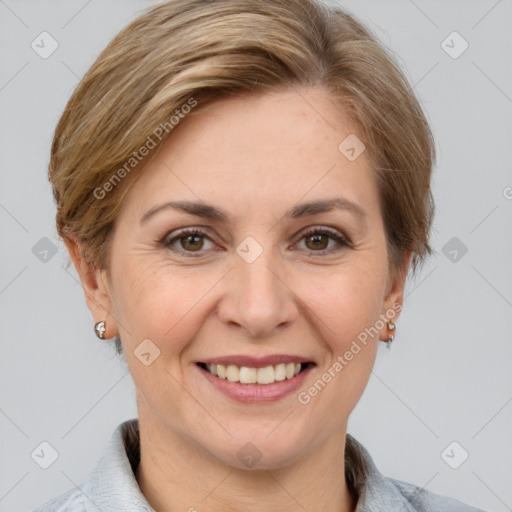 Joyful white adult female with medium  brown hair and grey eyes