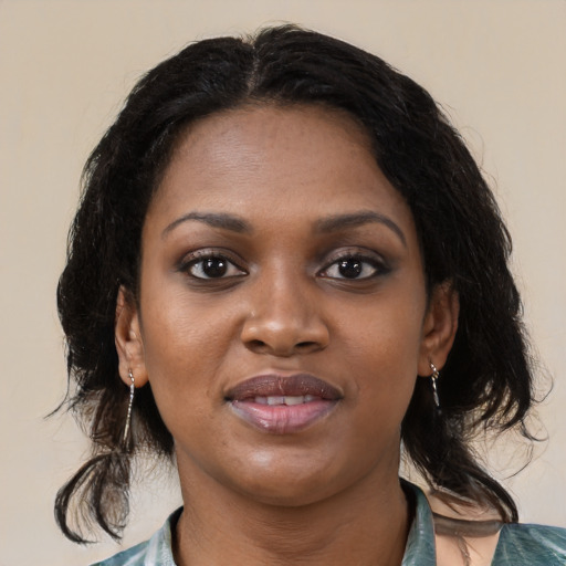 Joyful black young-adult female with medium  black hair and brown eyes