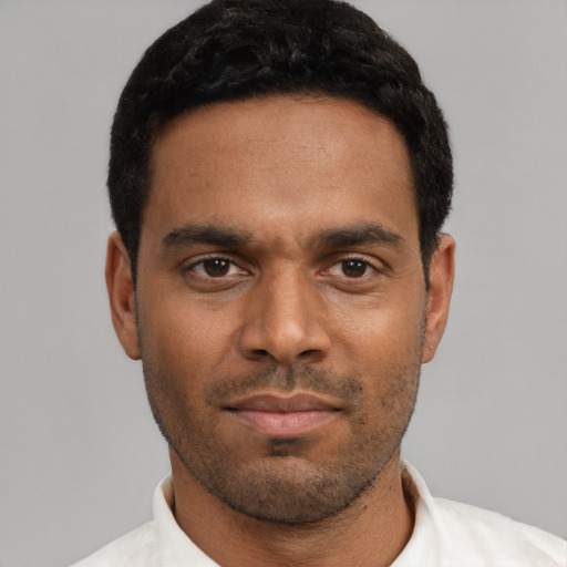 Neutral black young-adult male with short  black hair and brown eyes