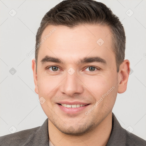 Joyful white young-adult male with short  brown hair and brown eyes