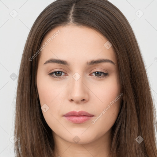 Neutral white young-adult female with long  brown hair and brown eyes