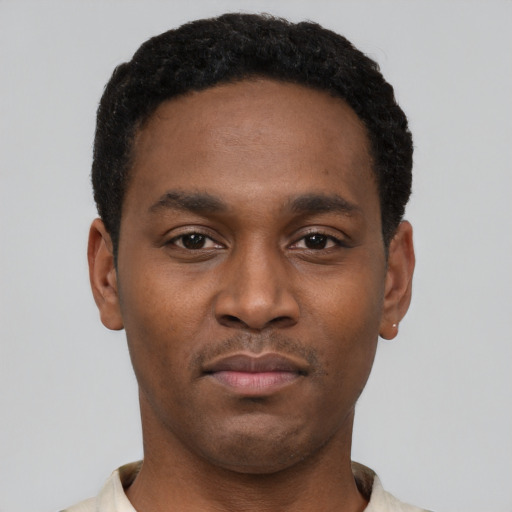 Neutral black young-adult male with short  black hair and brown eyes