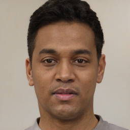 Neutral latino young-adult male with short  black hair and brown eyes