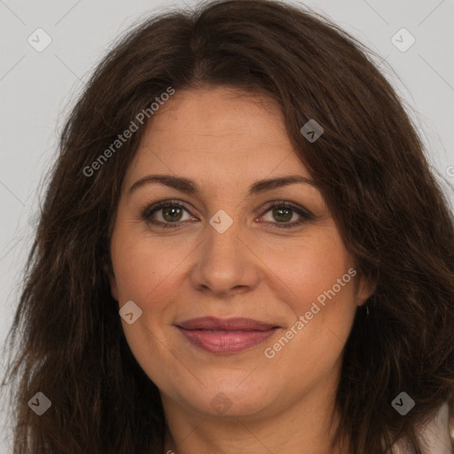 Joyful white adult female with long  brown hair and brown eyes